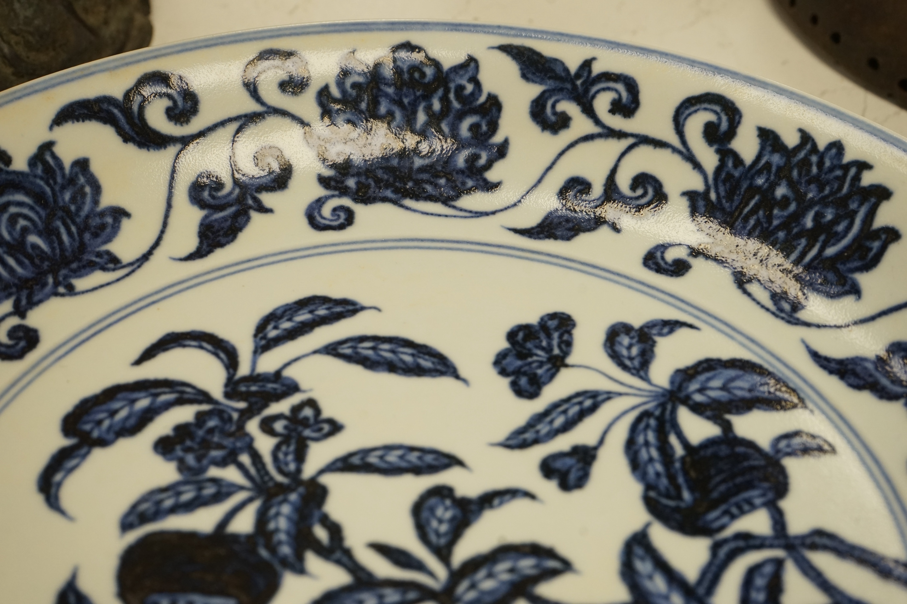 A Chinese blue and white pomegranate dish, 33cm diameter, Condition - firing crack to surface of dish
